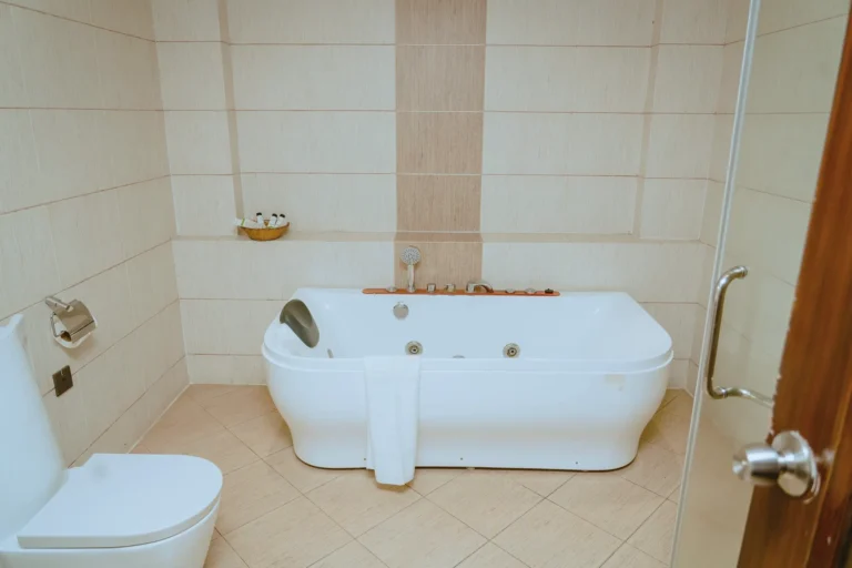Jacuzzi bathtub in a cream-tiled bathroom