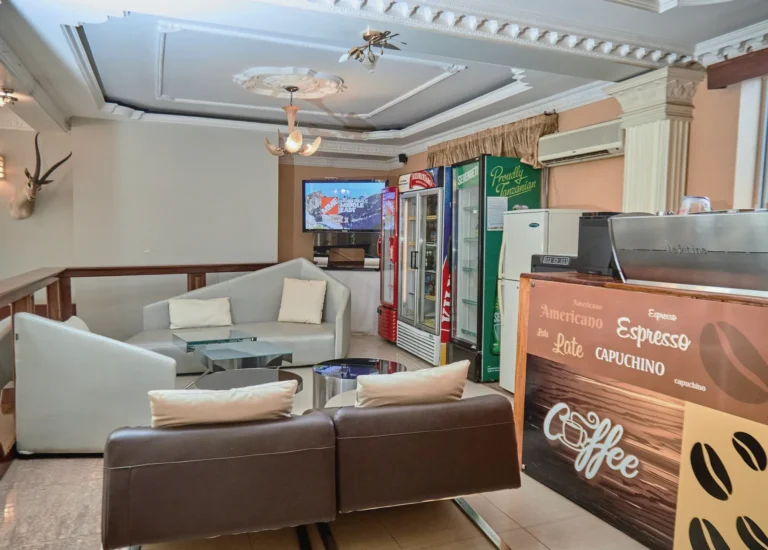 Coffee corner with sofas and an espresso counter
