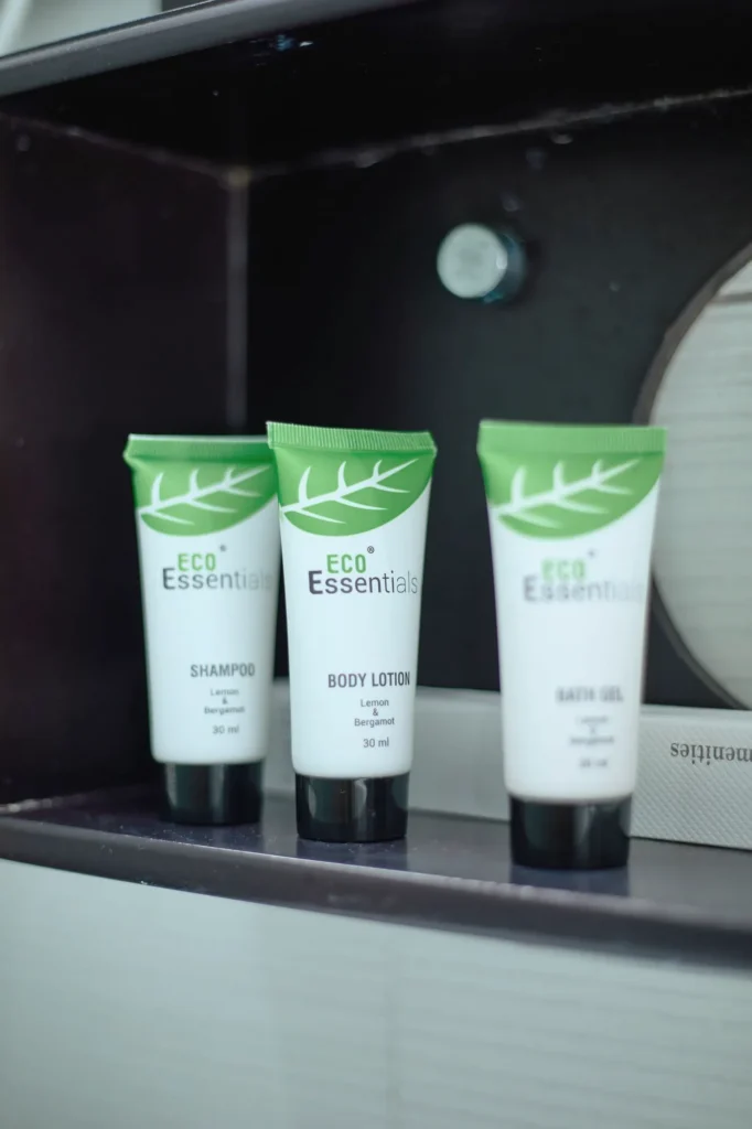Three bathroom toiletry tubes on a shelf